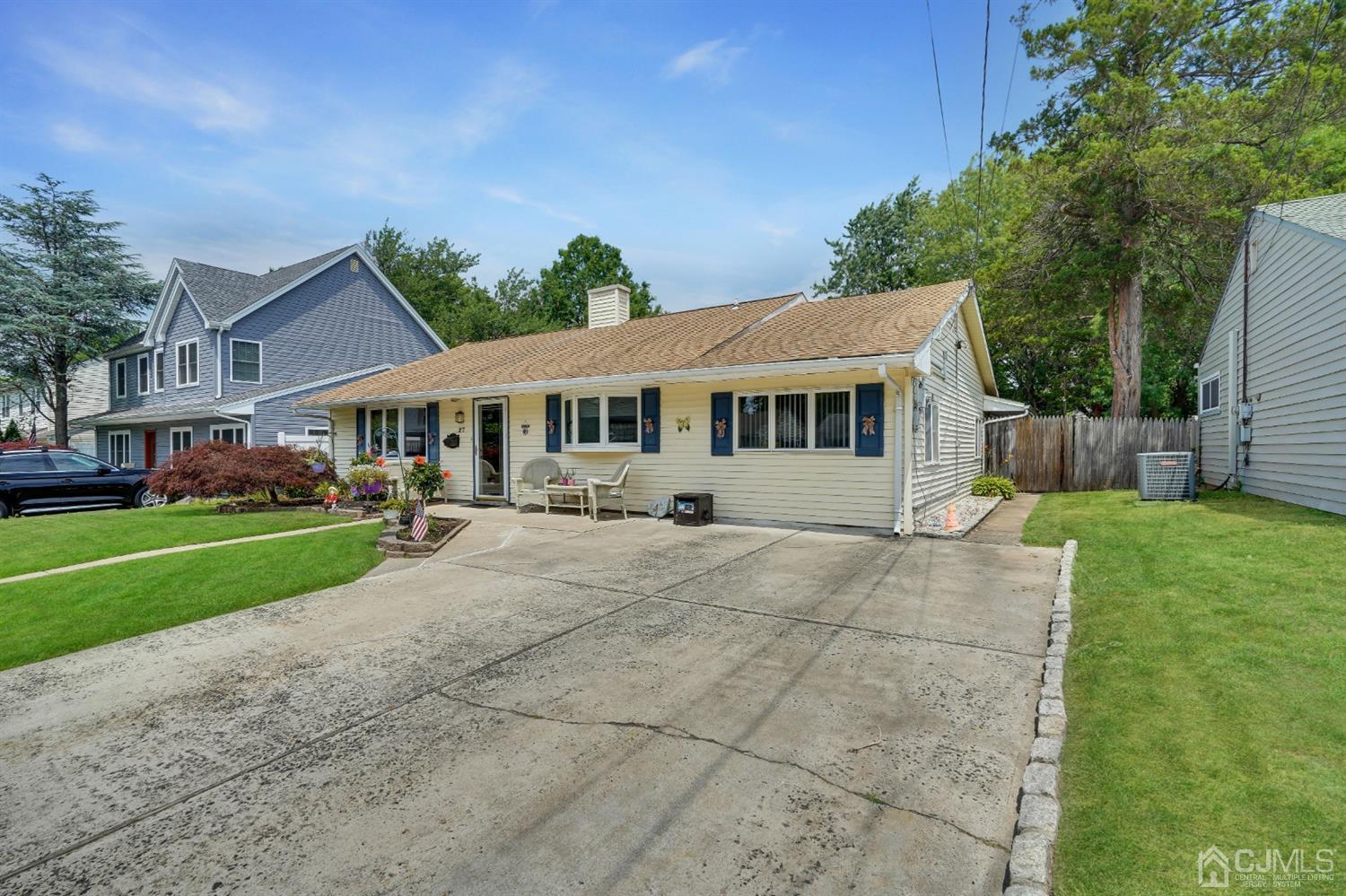 27 Raleigh Road Edison, NJ 08817 - Photo 3 of 29 a view of an house with backyard and a tree