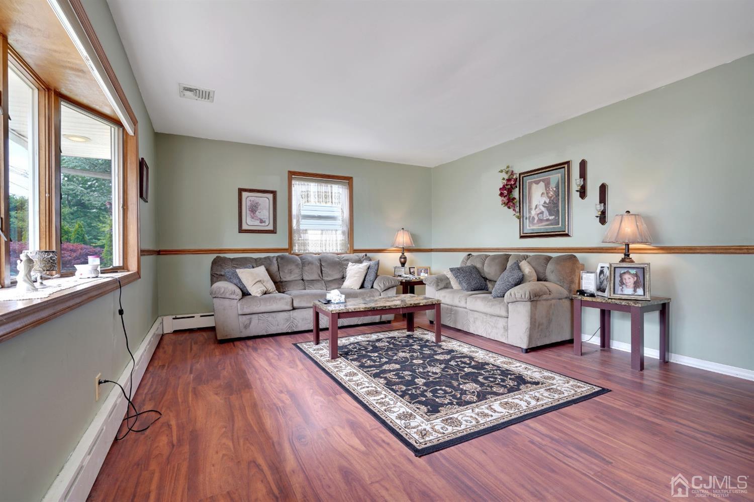 27 Raleigh Road Edison, NJ 08817 - Photo 4 of 29 a living room with furniture and a rug