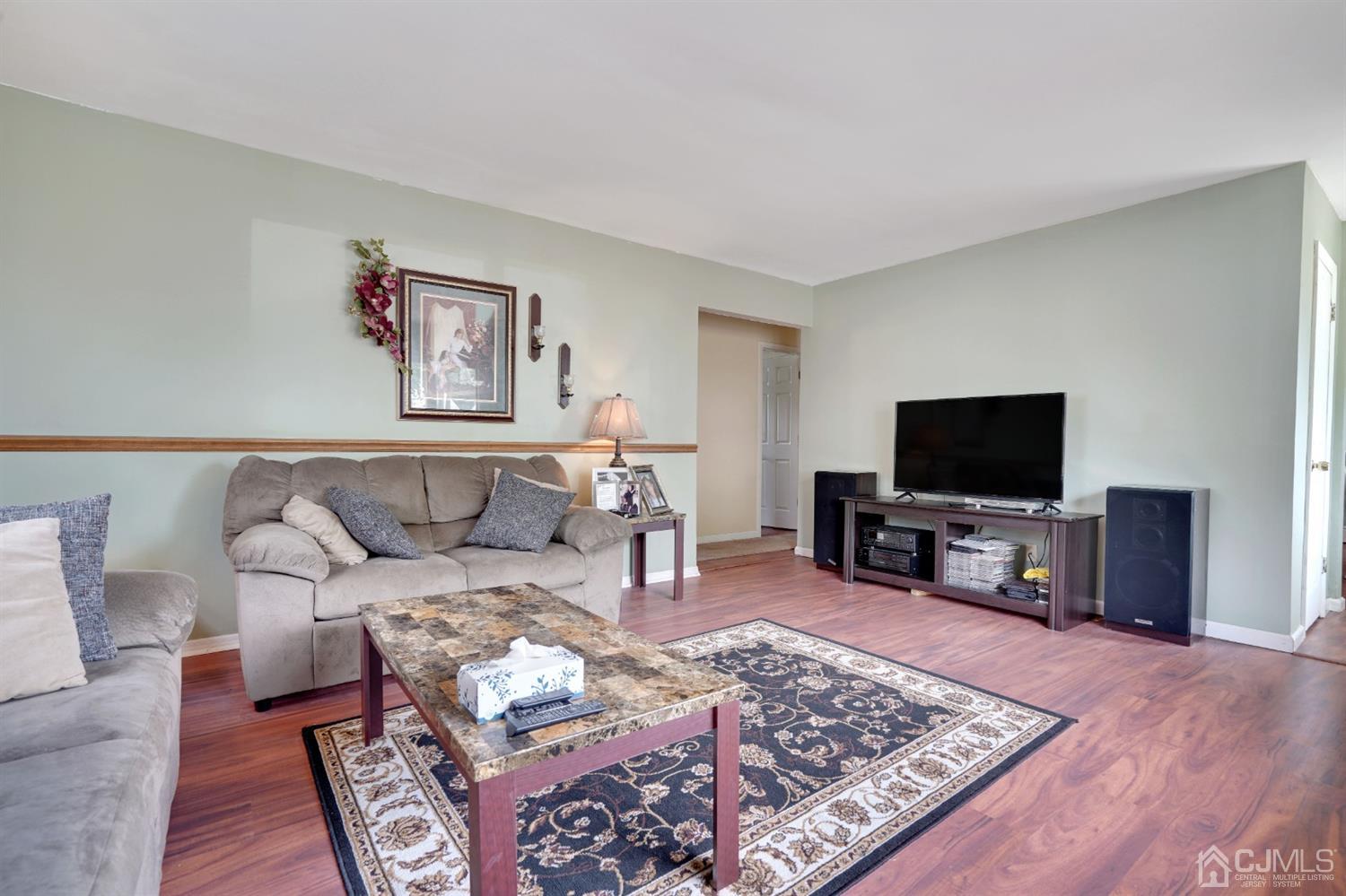 27 Raleigh Road Edison, NJ 08817 - Photo 6 of 29 a living room with furniture and a flat screen tv