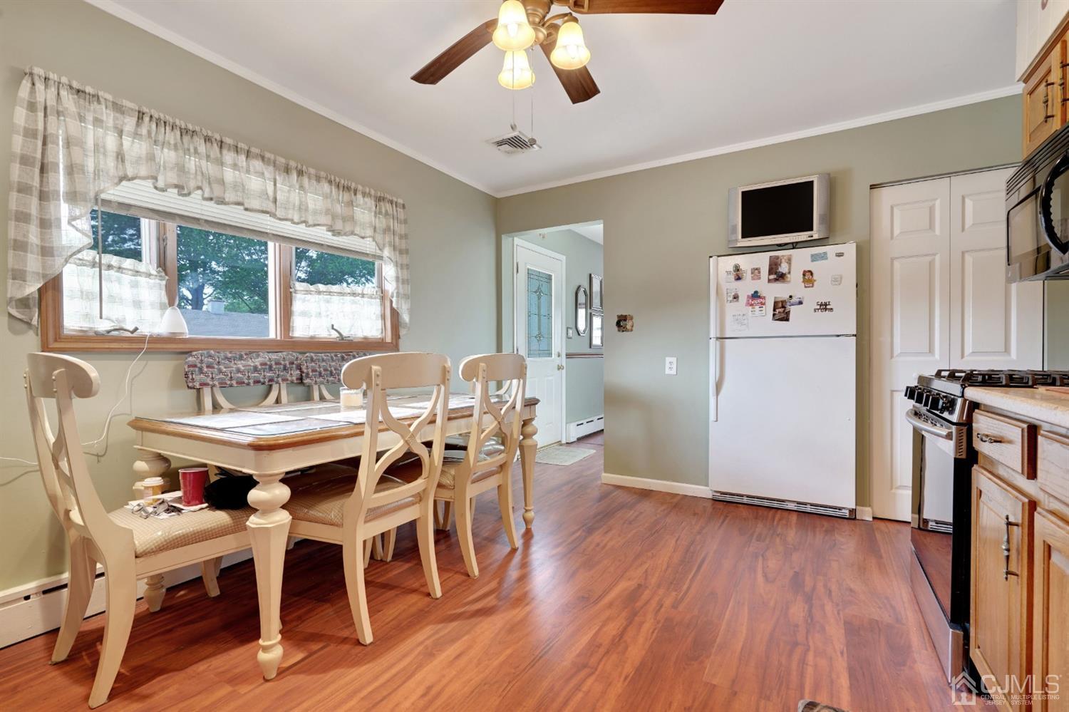 27 Raleigh Road Edison, NJ 08817 - Photo 8 of 29 a view of a dining room with furniture window and wooden floor