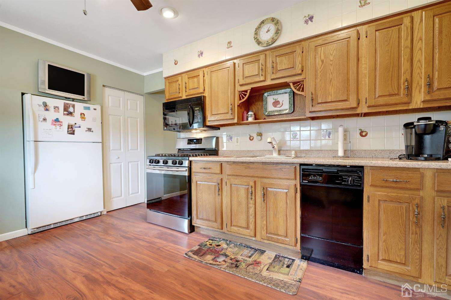 27 Raleigh Road Edison, NJ 08817 - Photo 9 of 29 a kitchen with stainless steel appliances granite countertop a refrigerator and a stove top oven