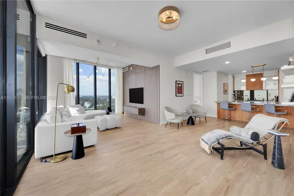 a living room with furniture and a table