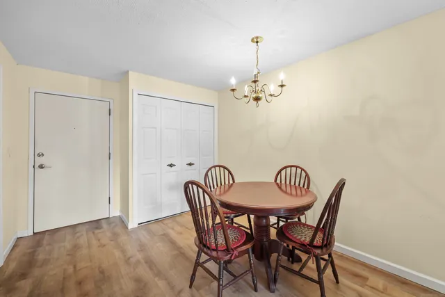 a dining room with furniture and chandelier