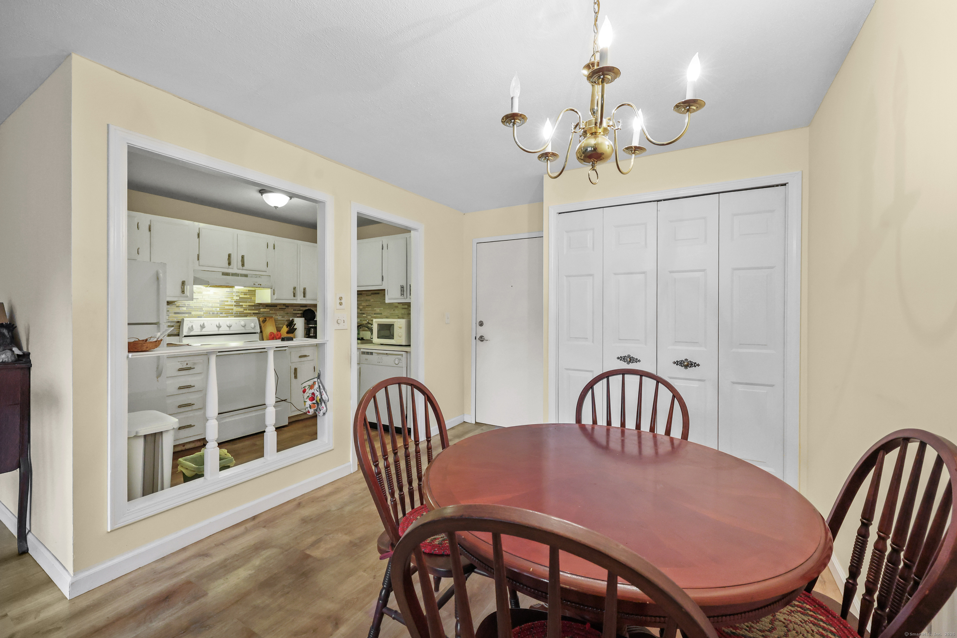 60 Rambling Brook Lane, Unit C8 Glastonbury, CT 06033 - Photo 12 of 20 a view of a dining room with furniture window and wooden floor