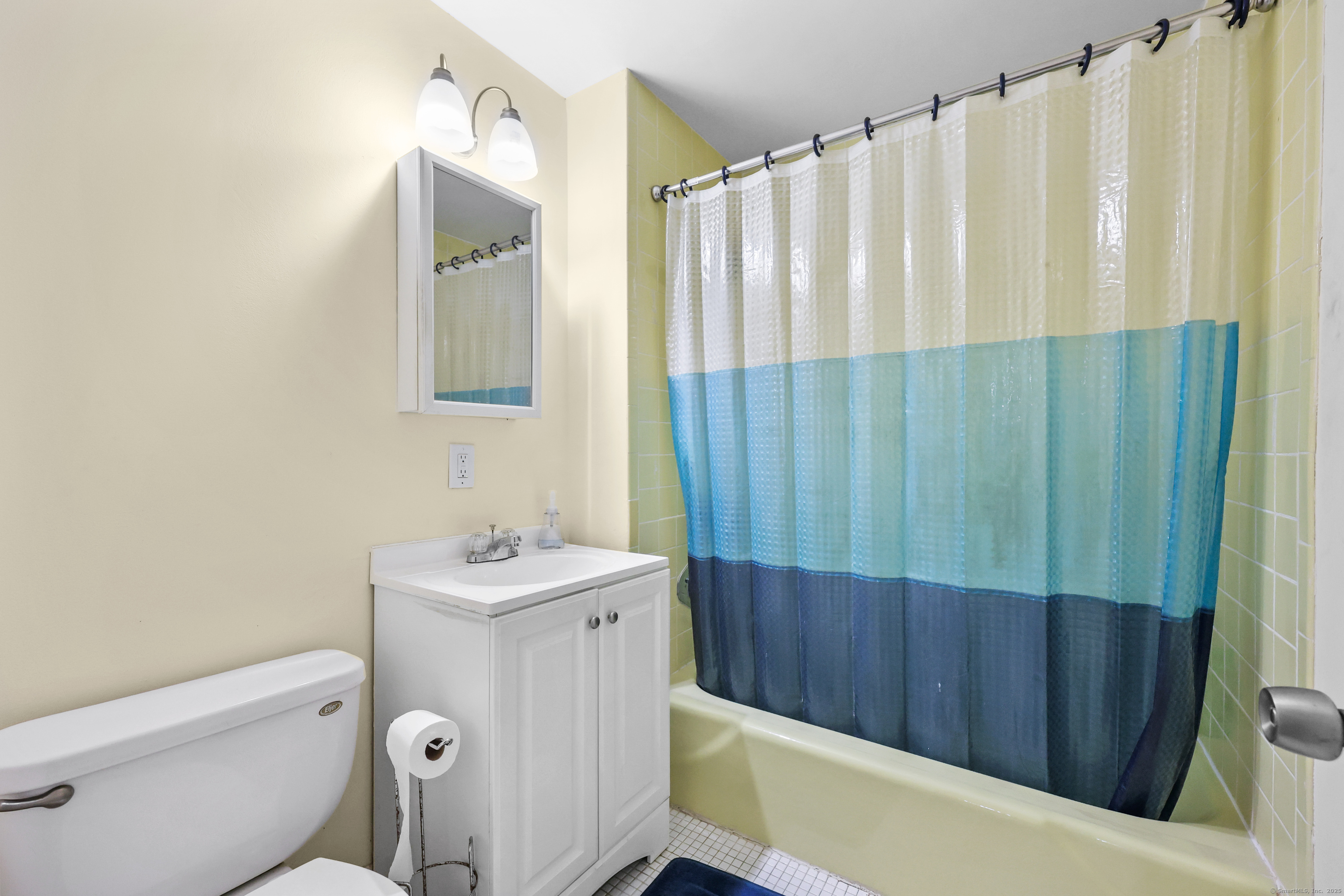 60 Rambling Brook Lane, Unit C8 Glastonbury, CT 06033 - Photo 16 of 20 a bathroom with a sink a toilet and shower curtain