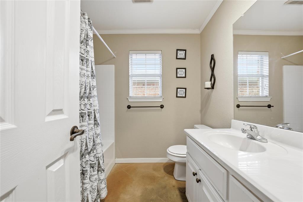 10504 Whitney Trace Drive Waco, TX 76708 - Photo 17 of 24 a bathroom with a sink toilet and shower