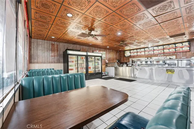 a view of a chairs and tables in a patio