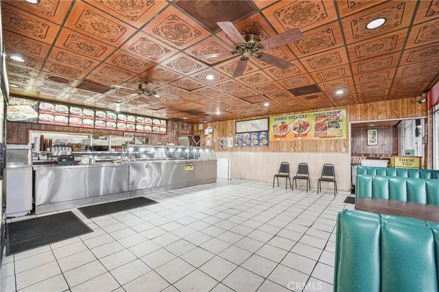 a large white kitchen with a large window