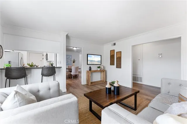a kitchen with stainless steel appliances a stove a sink and a refrigerator