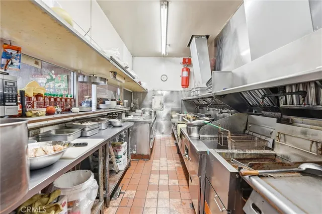 a kitchen with counter top space and stainless steel appliances