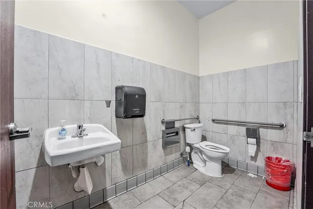 a bedroom with furniture and a large window