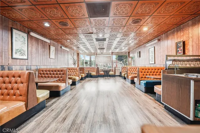 a view of a living room and a wooden floor