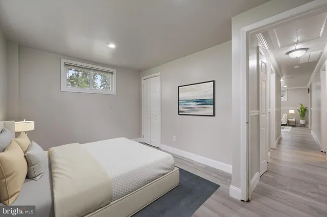 a bedroom with a bed and a view of bathroom