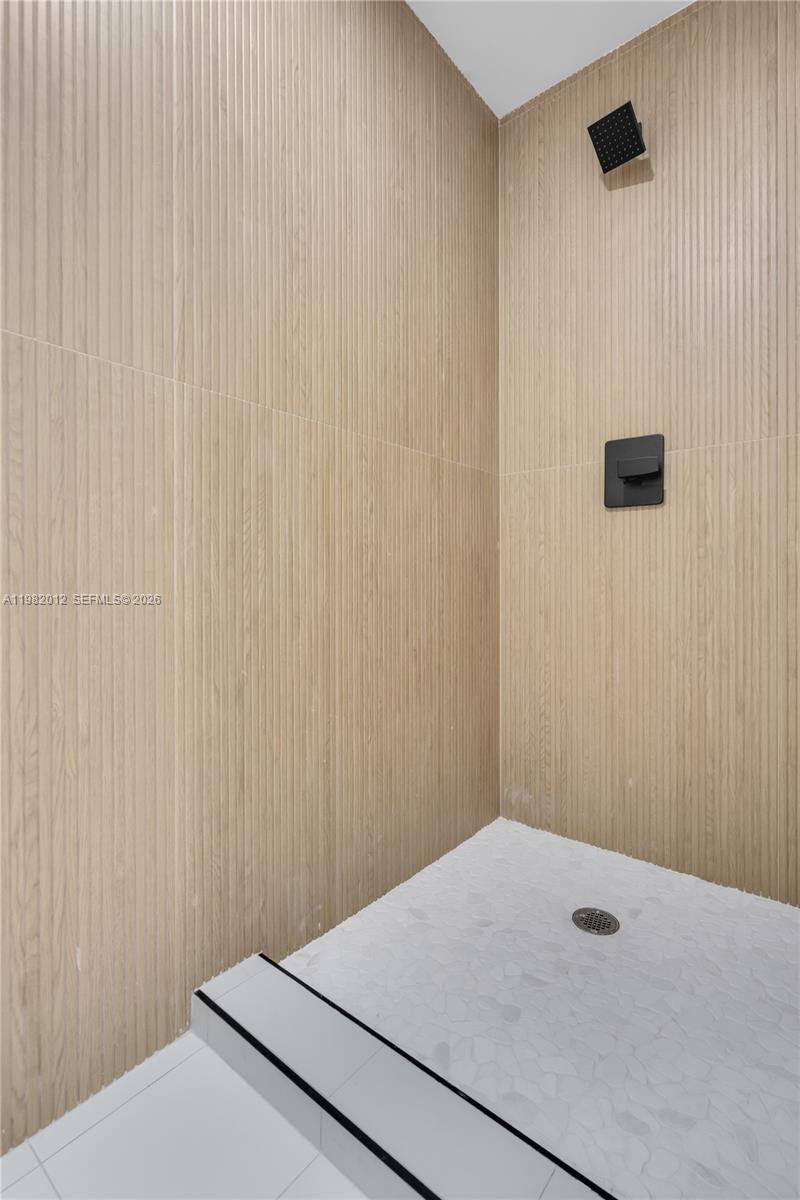 1037 Northwest 2nd Street, Unit 2B2 Miami, FL 33128 - Photo 9 of 15 a bathroom with a shower