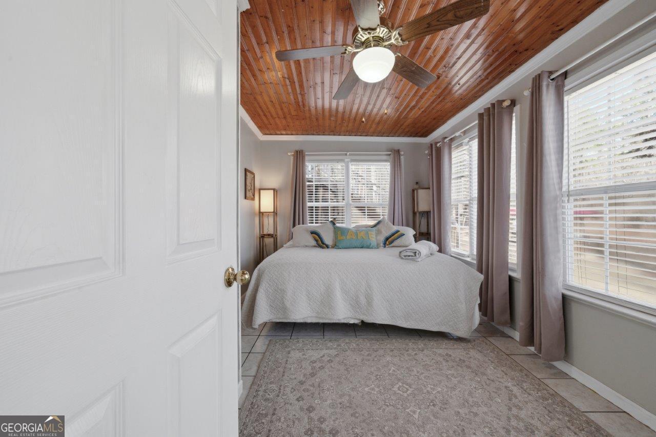 109 Horseshoe Bend Road Southwest Eatonton, GA 31024 - Photo 32 of 42 a bed room with a bed and a window