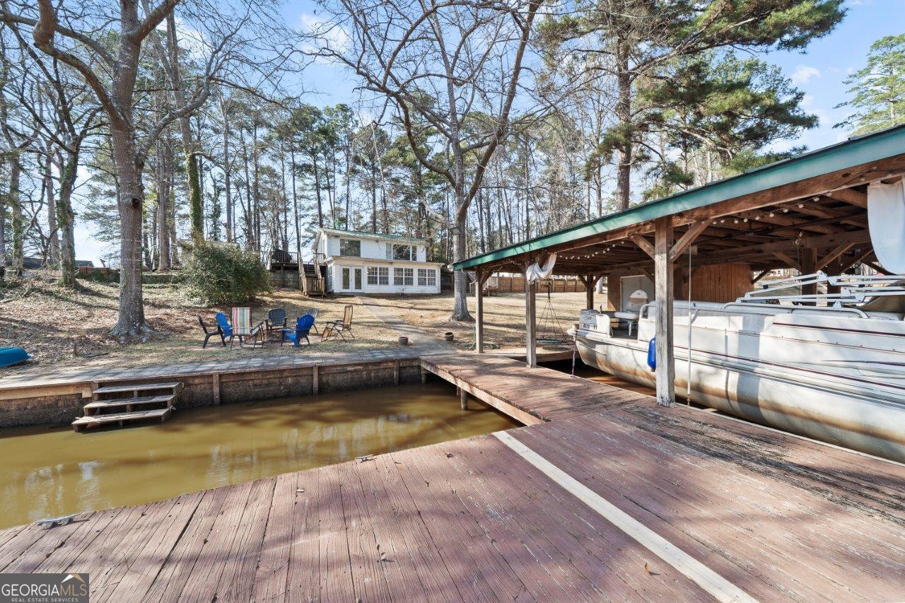 109 Horseshoe Bend Road Southwest Eatonton, GA 31024 - Photo 39 of 42 a view of a swimming pool with a lounge chair