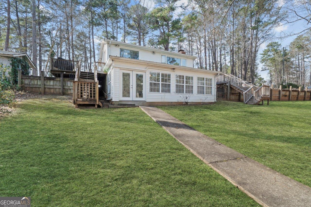 109 Horseshoe Bend Road Southwest Eatonton, GA 31024 - Photo 40 of 42 a view of a house with a big yard