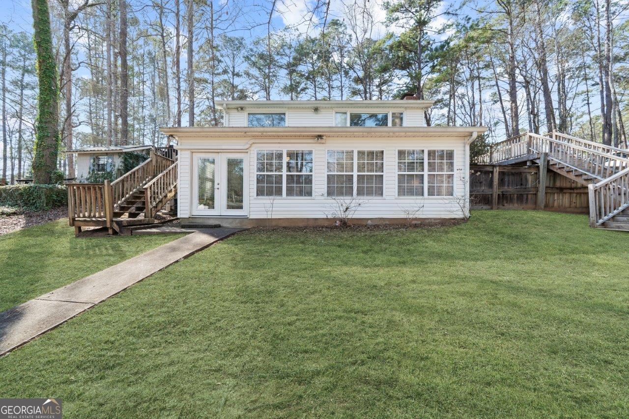 109 Horseshoe Bend Road Southwest Eatonton, GA 31024 - Photo 41 of 42 front view of a house with a yard