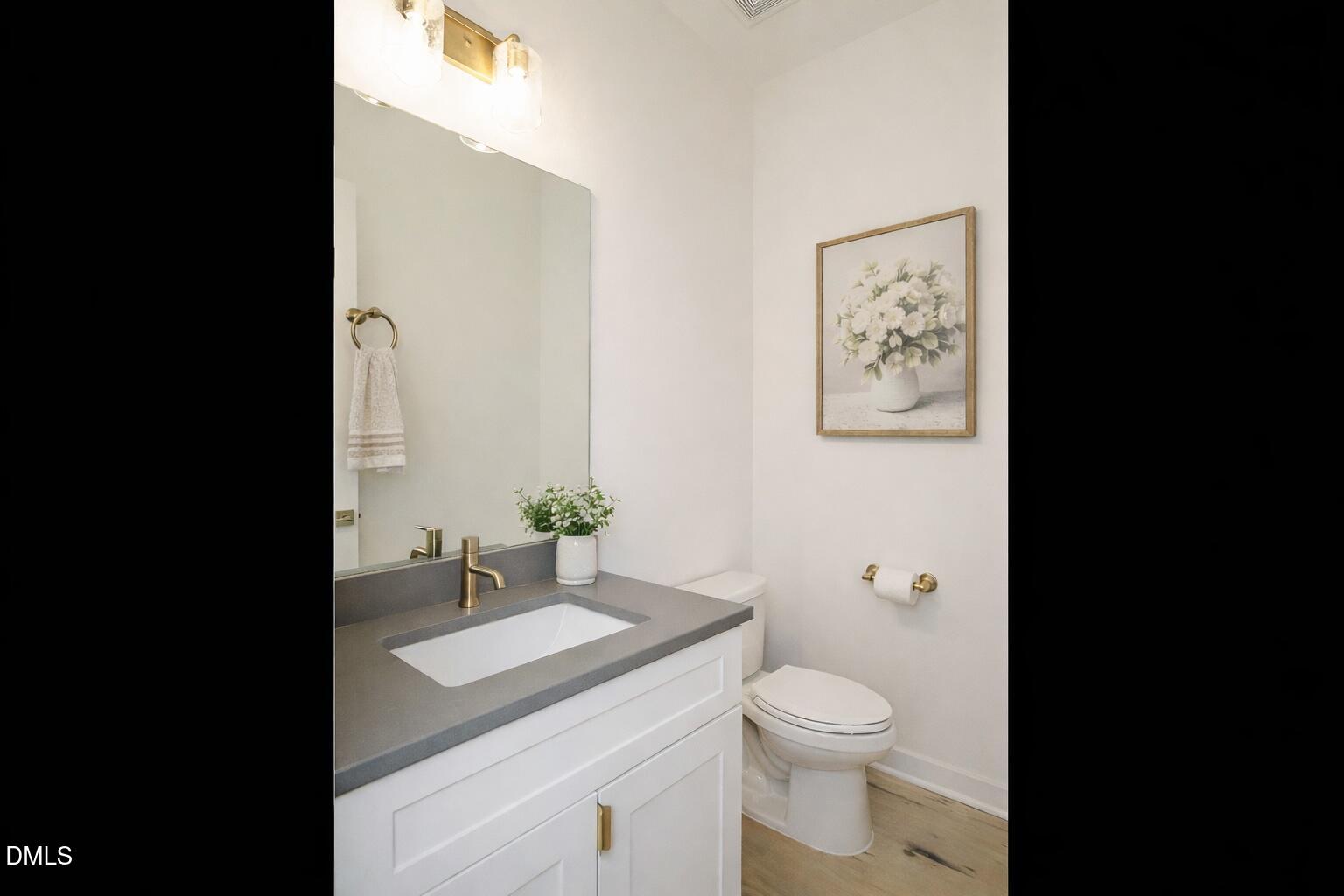 1533 Urban Trace Lane Raleigh, NC 27608 - Photo 17 of 28 a bathroom with a granite countertop sink toilet and shower