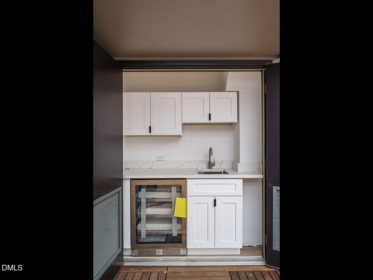 1533 Urban Trace Lane Raleigh, NC 27608 - Photo 24 of 28 a kitchen with a sink and cabinets