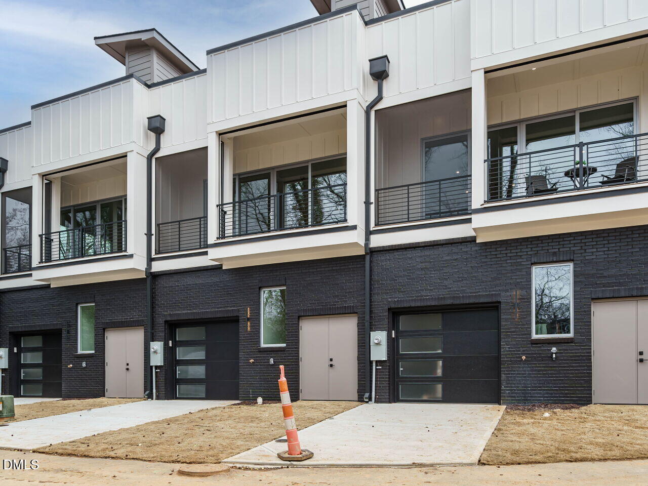1533 Urban Trace Lane Raleigh, NC 27608 - Photo 25 of 28 a building that has a sign on it