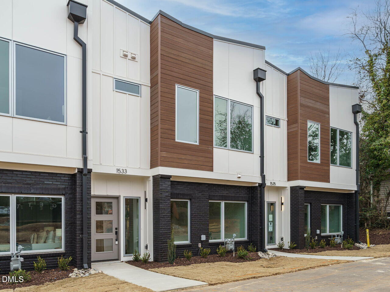 1533 Urban Trace Lane Raleigh, NC 27608 - Photo 3 of 28 a front view of a brick building