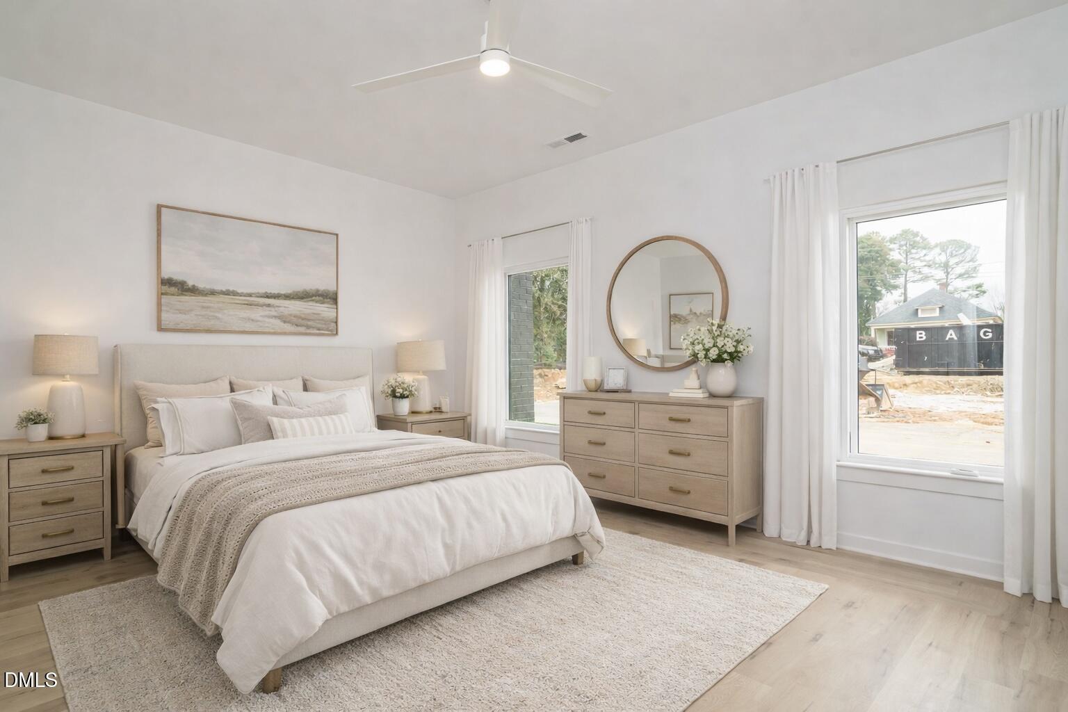 1533 Urban Trace Lane Raleigh, NC 27608 - Photo 5 of 28 a bedroom with a bed a mirror and a large window