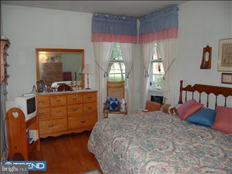 2015 Surrey Road Oreland, PA 19075 - Photo 6 of 6 a bed room with a bed and a dresser