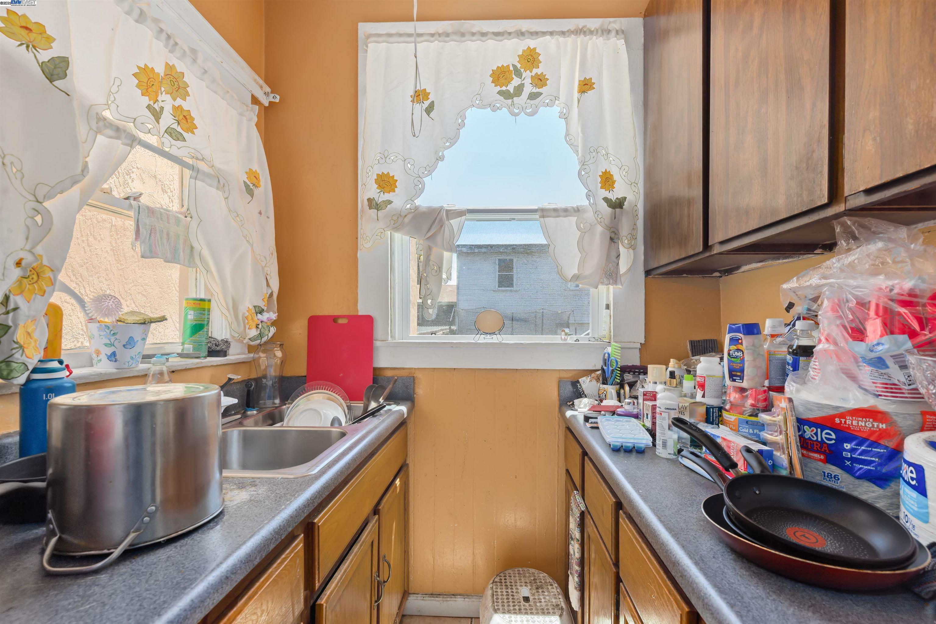 845 Isabella Street Oakland, CA 94607 - Photo 12 of 31 a kitchen with stainless steel appliances a sink a stove and a refrigerator
