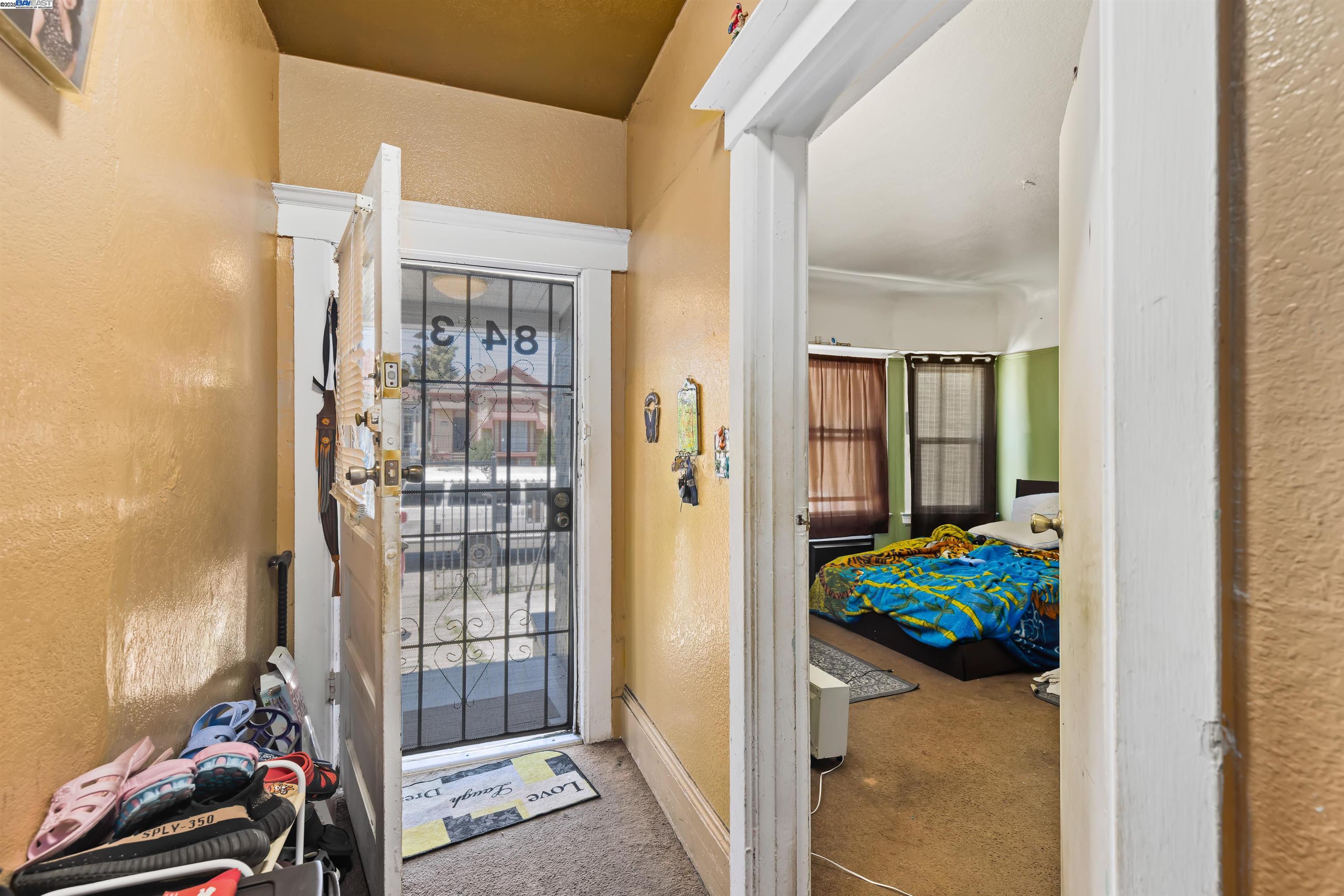 845 Isabella Street Oakland, CA 94607 - Photo 5 of 31 a living room with furniture and a floor to ceiling window