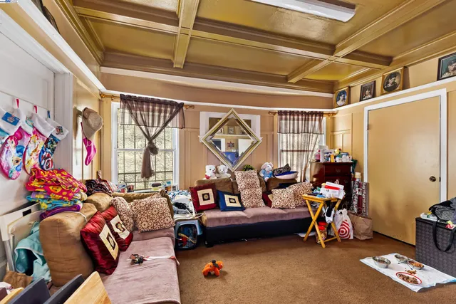 a bedroom with furniture and a baby crib