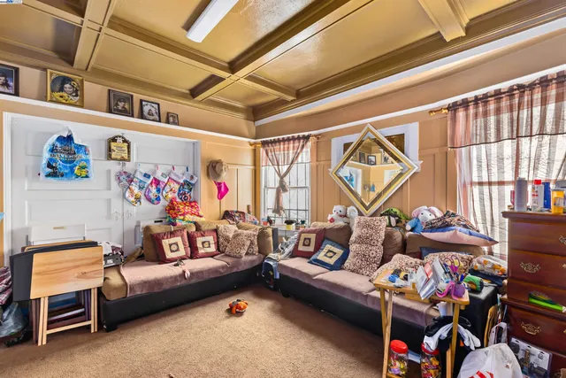 a view of a room with workspace and toys