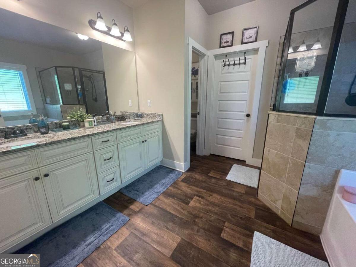 457 Old Good Hope Road Good Hope, GA 30641 - Photo 13 of 59 a bathroom with a double vanity sink and a mirror