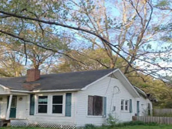 a front view of a house with yard