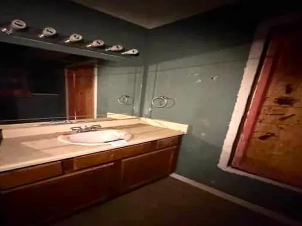 a bathroom with a sink and a mirror