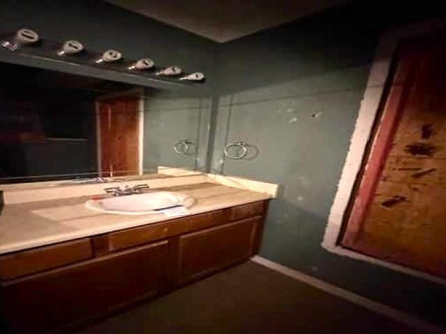 6098 Highway 2 Sarepta, LA 71071 - Photo 7 of 8 a bathroom with a sink and a mirror