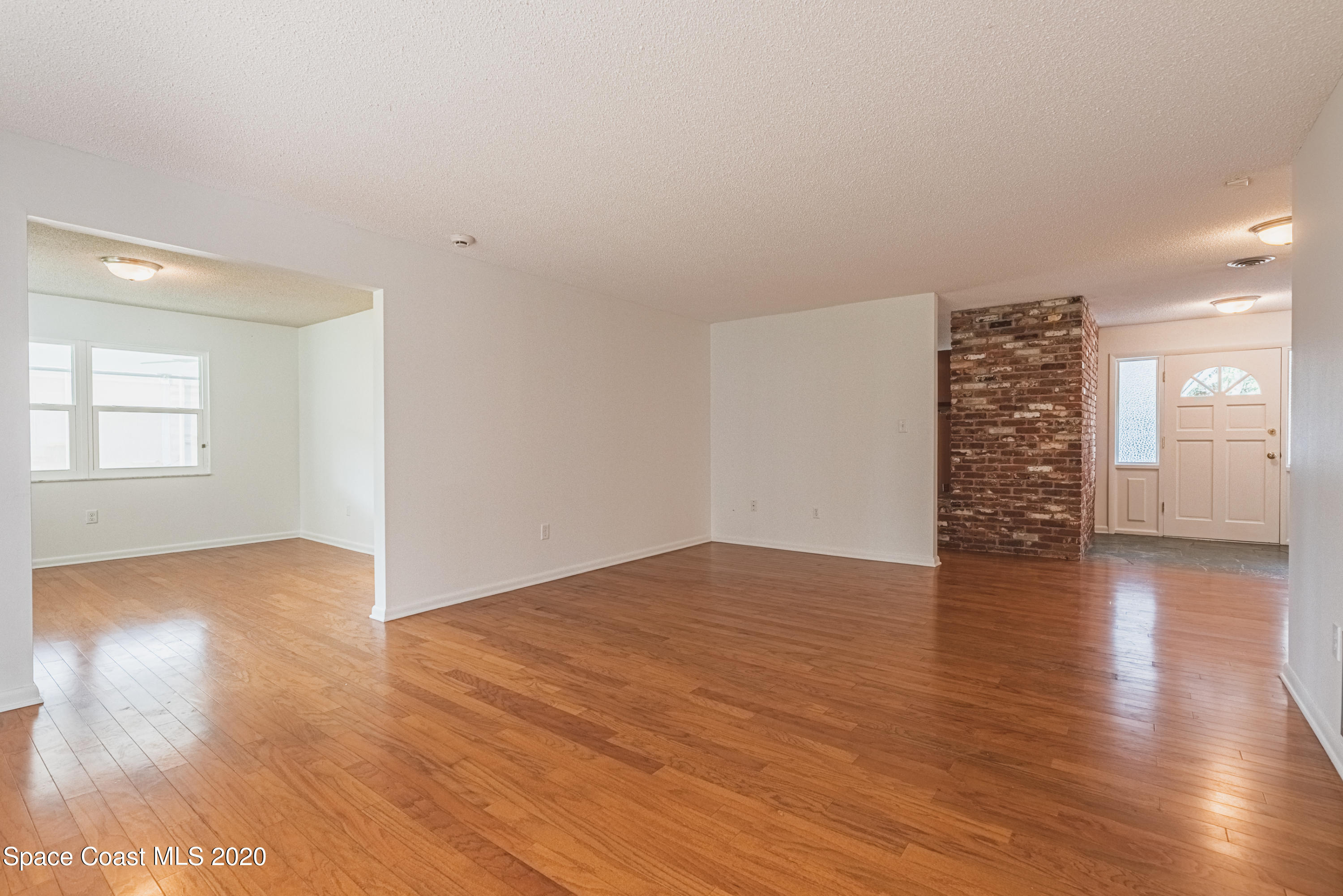 1945 Trimble Road Melbourne, FL 32934 - Photo 16 of 83 wooden floor in an empty room