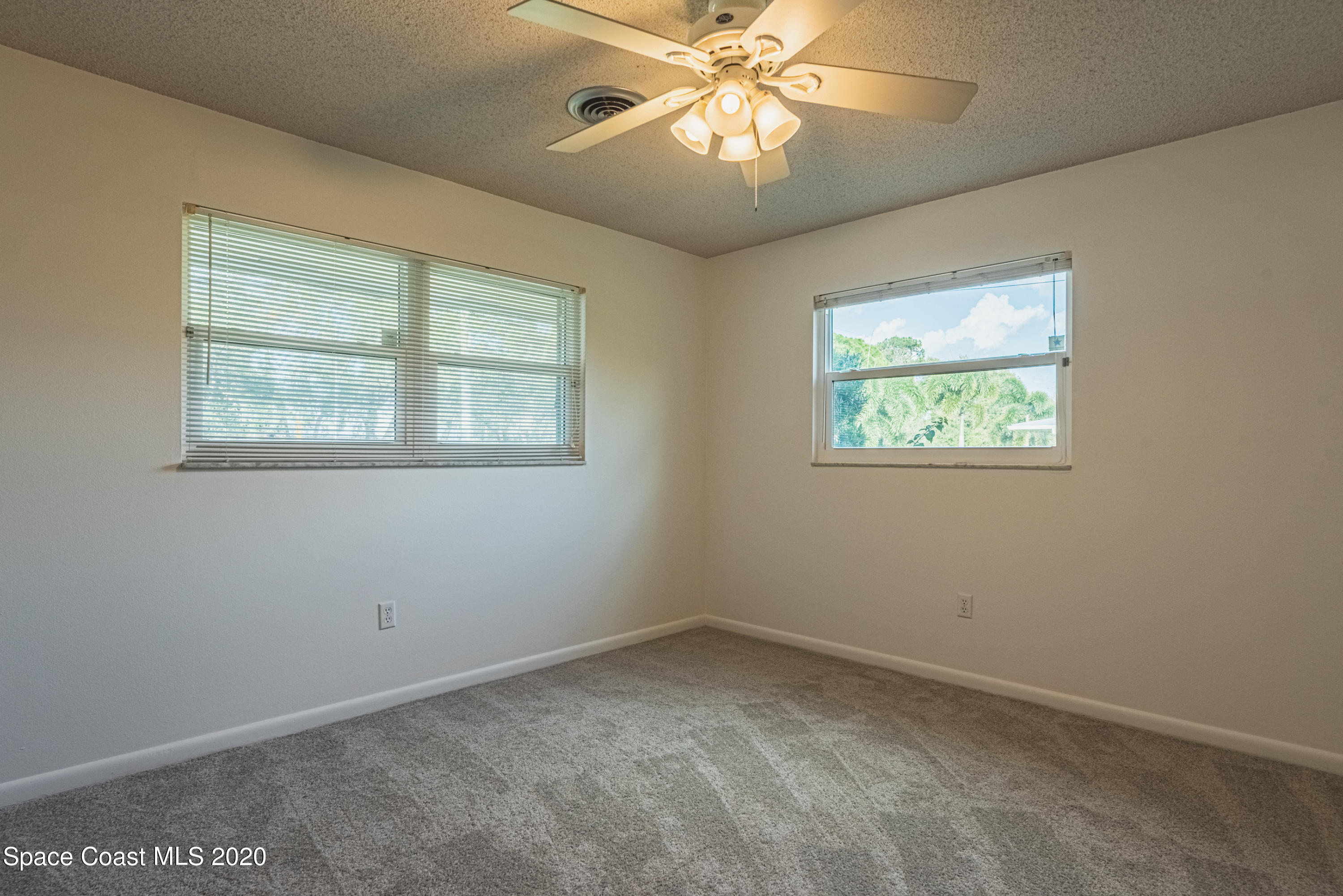 1945 Trimble Road Melbourne, FL 32934 - Photo 36 of 83 an empty room with a window