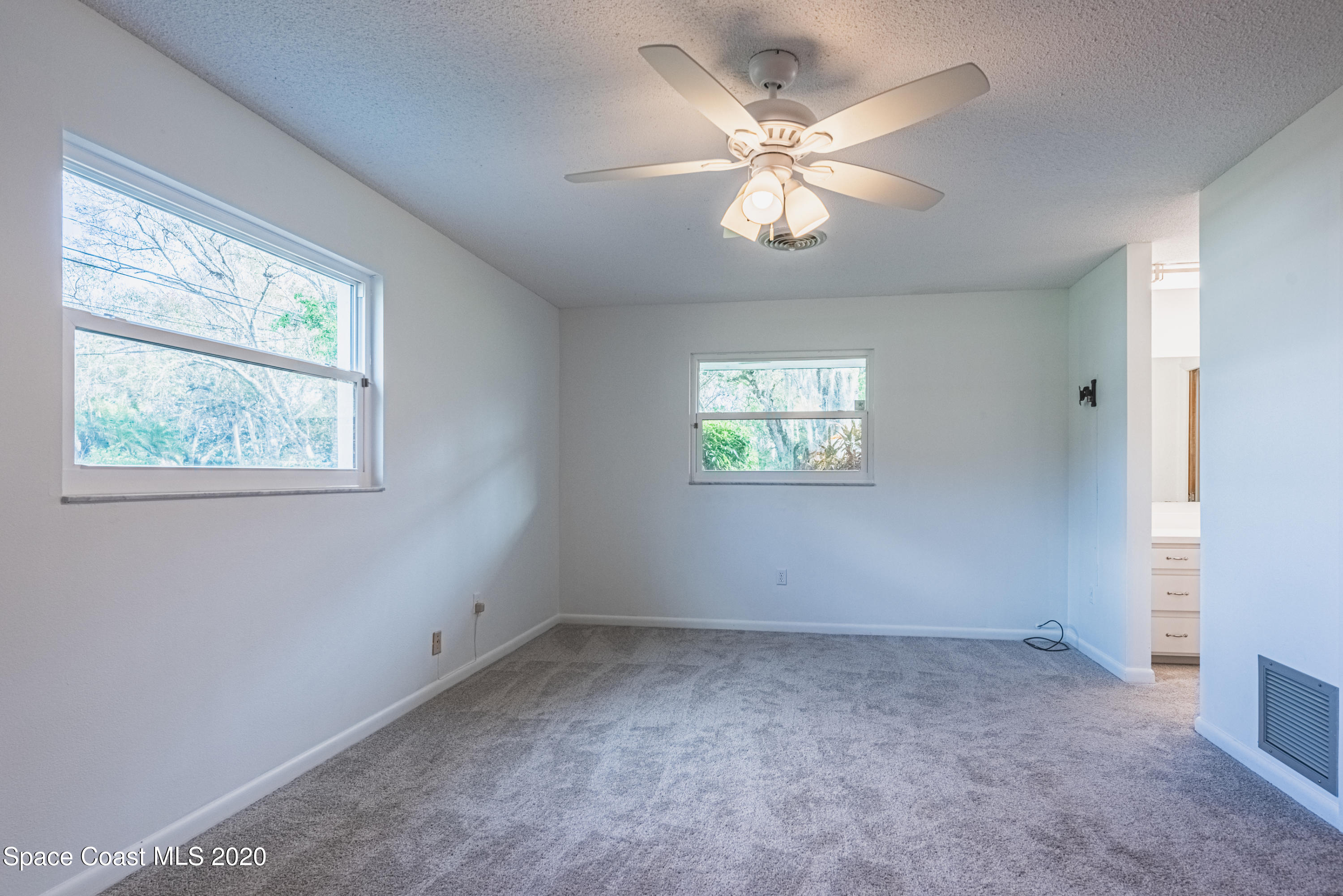 1945 Trimble Road Melbourne, FL 32934 - Photo 38 of 83 an empty room with a window