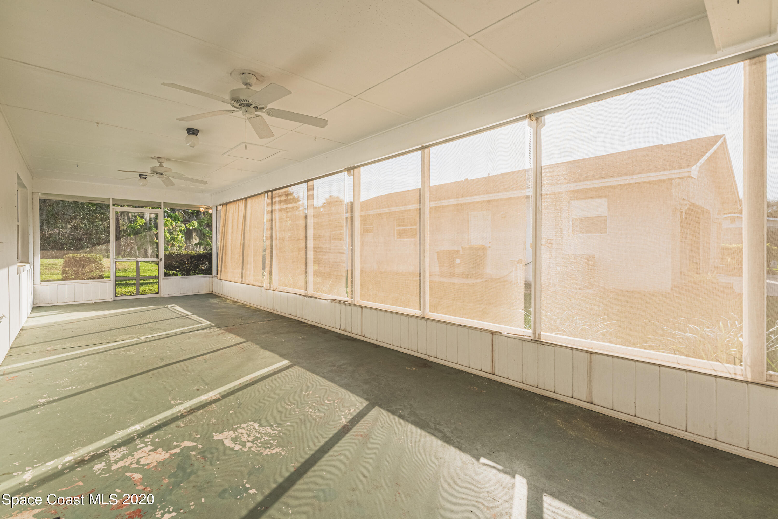 1945 Trimble Road Melbourne, FL 32934 - Photo 45 of 83 a view of an empty room with a window