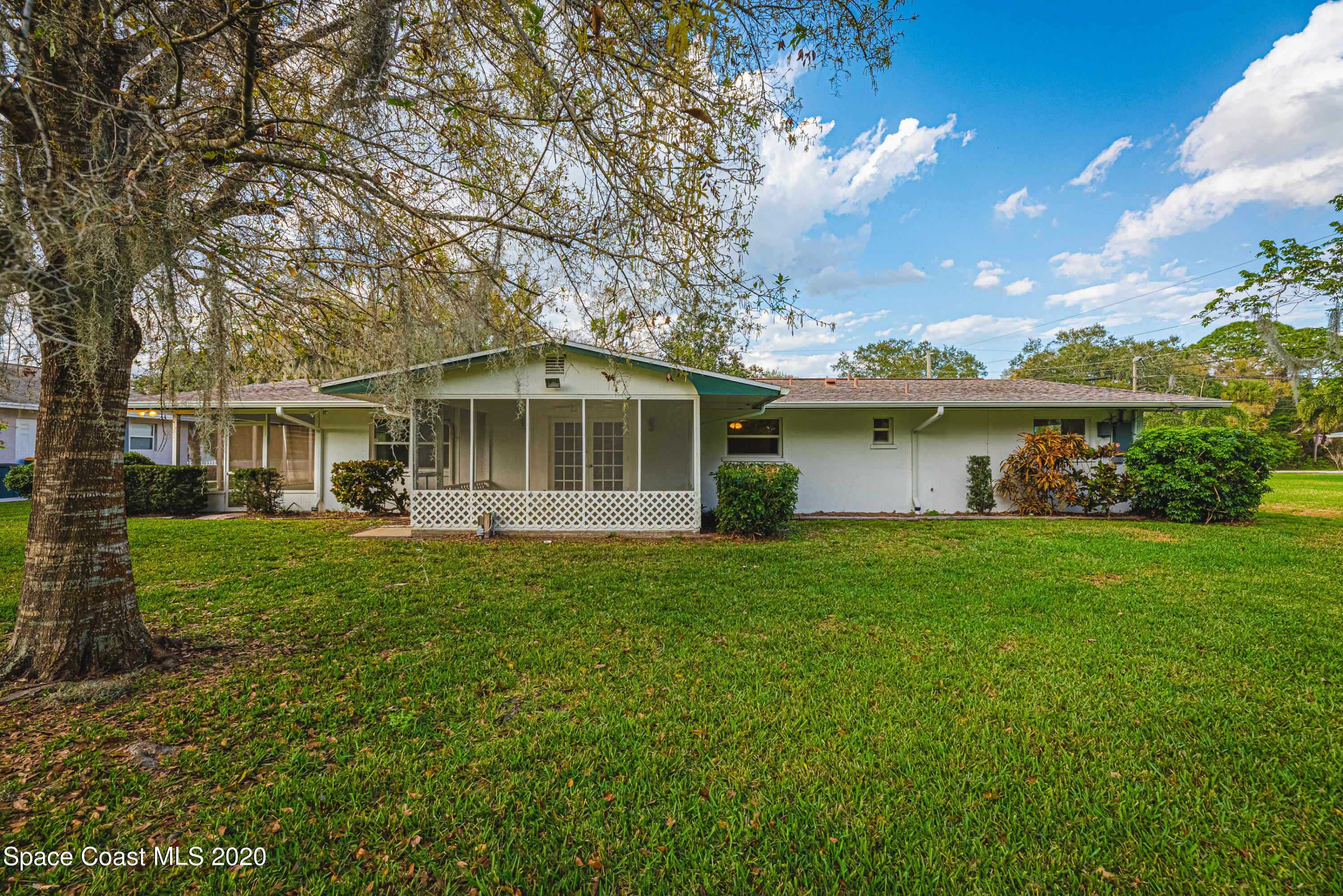 1945 Trimble Road Melbourne, FL 32934 - Photo 50 of 83 a front view of a house with a garden