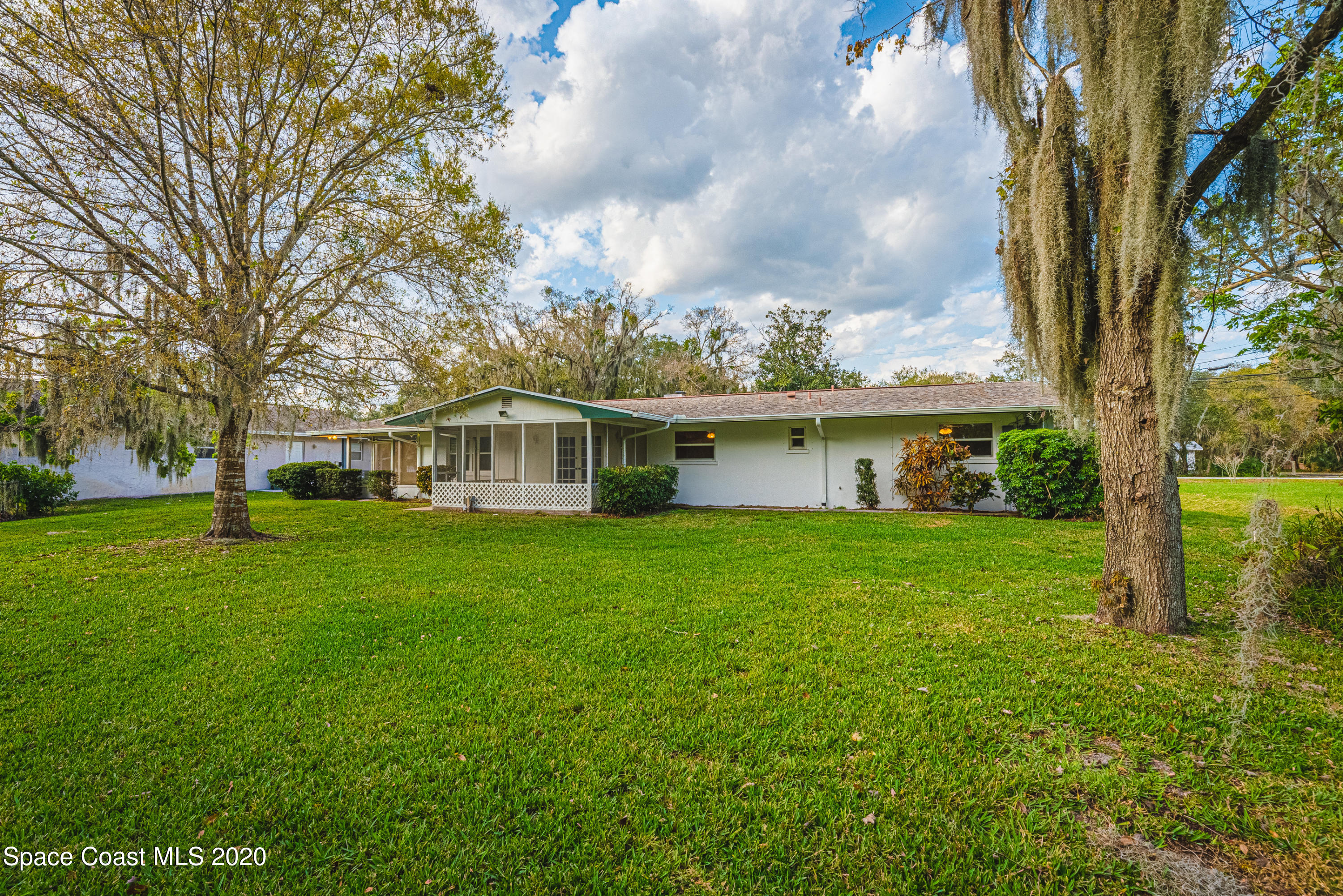 1945 Trimble Road Melbourne, FL 32934 - Photo 51 of 83 a front view of a house with garden