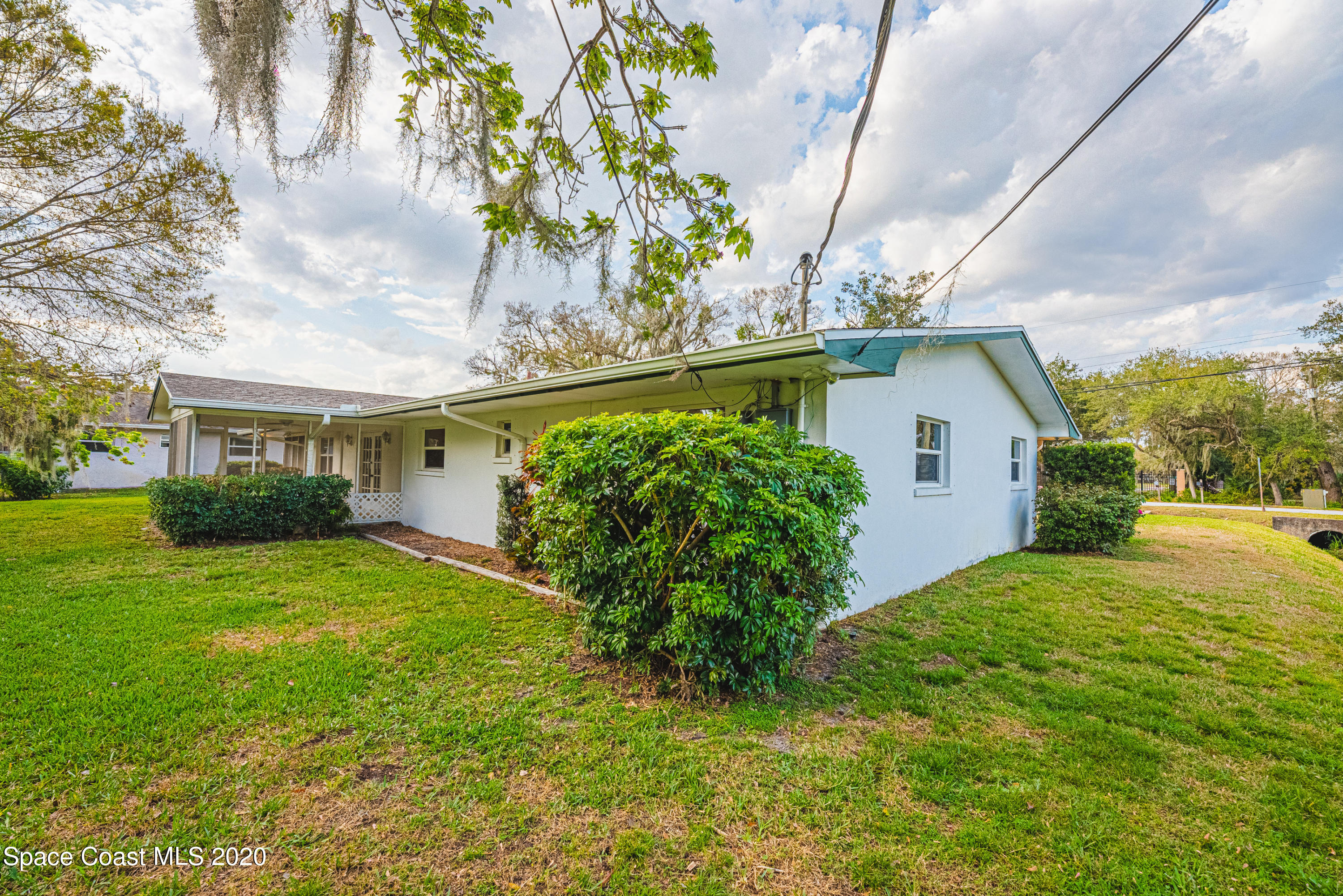1945 Trimble Road Melbourne, FL 32934 - Photo 53 of 83 a view of a house with a yard