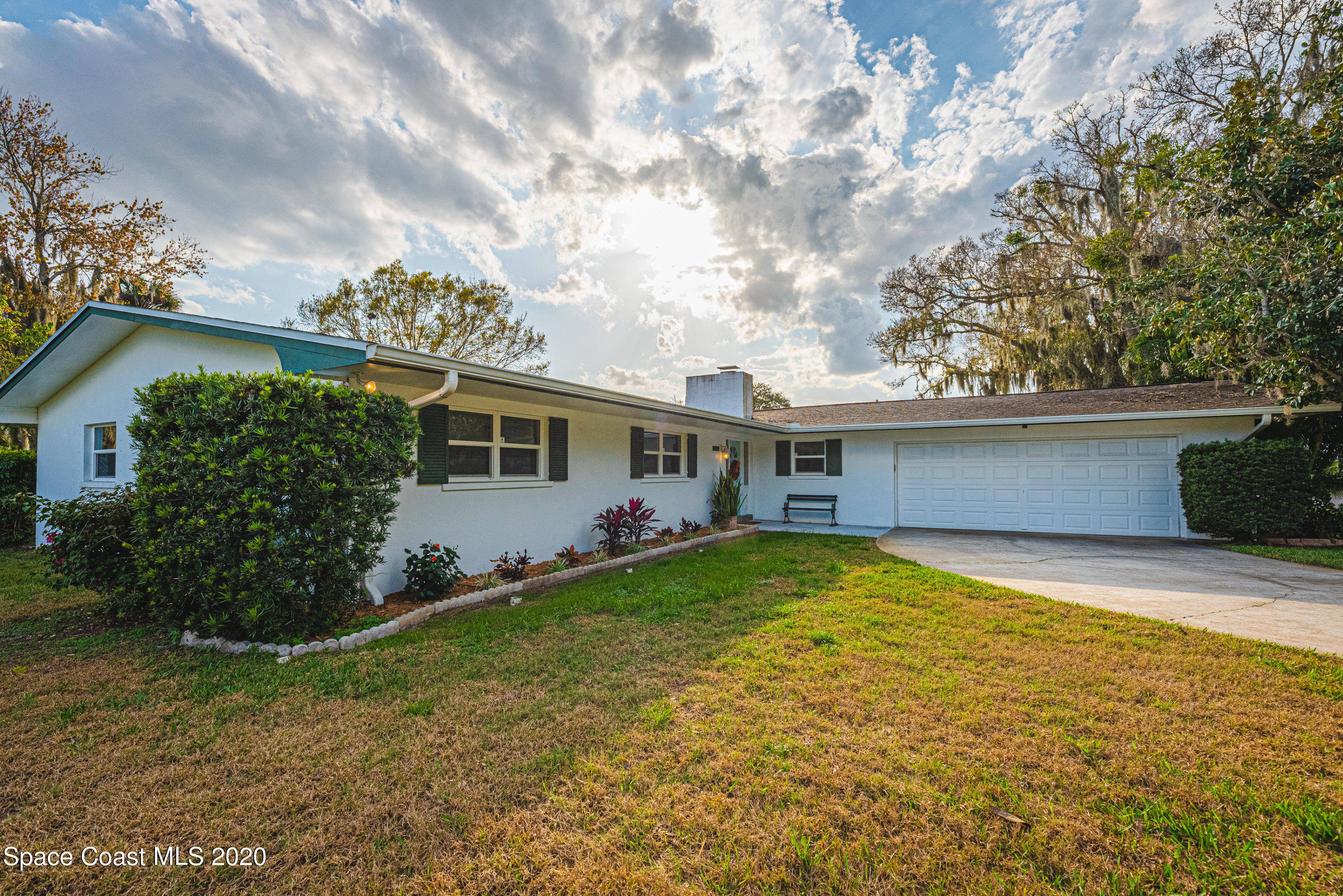 1945 Trimble Road Melbourne, FL 32934 - Photo 54 of 83 a view of a house with a yard