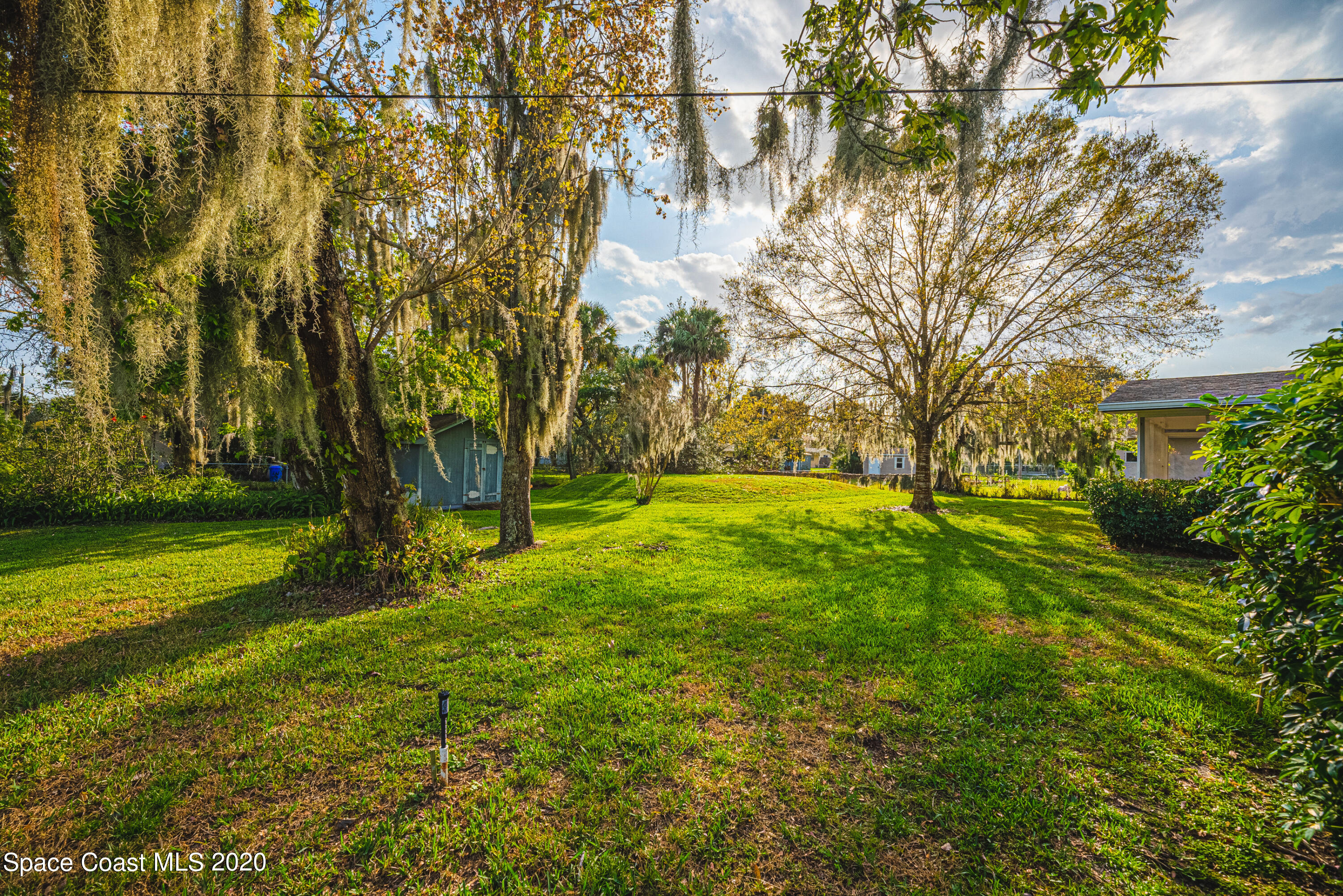 1945 Trimble Road Melbourne, FL 32934 - Photo 61 of 83 a view of an trees in front of a house