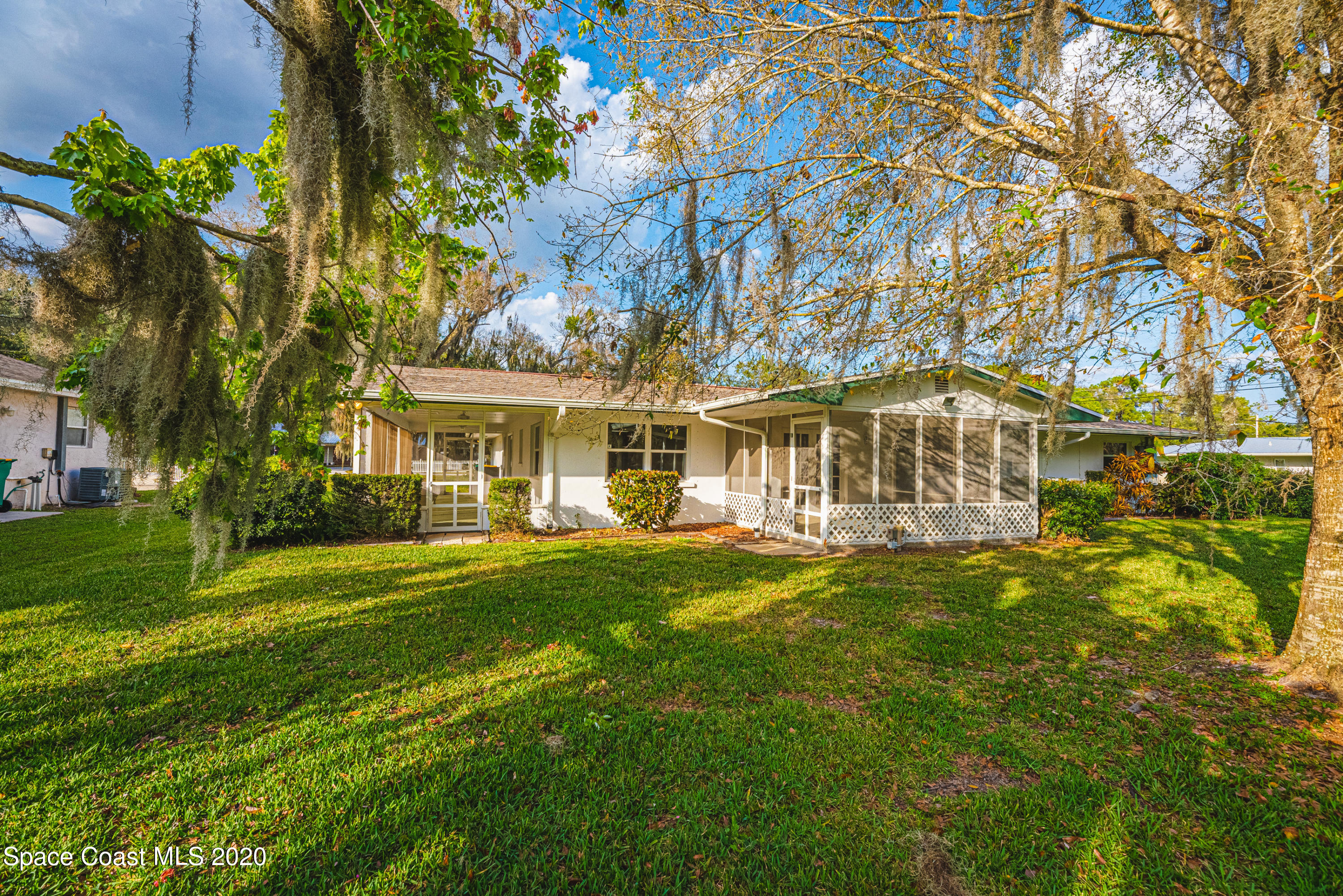 1945 Trimble Road Melbourne, FL 32934 - Photo 8 of 83 a front view of a house with a garden
