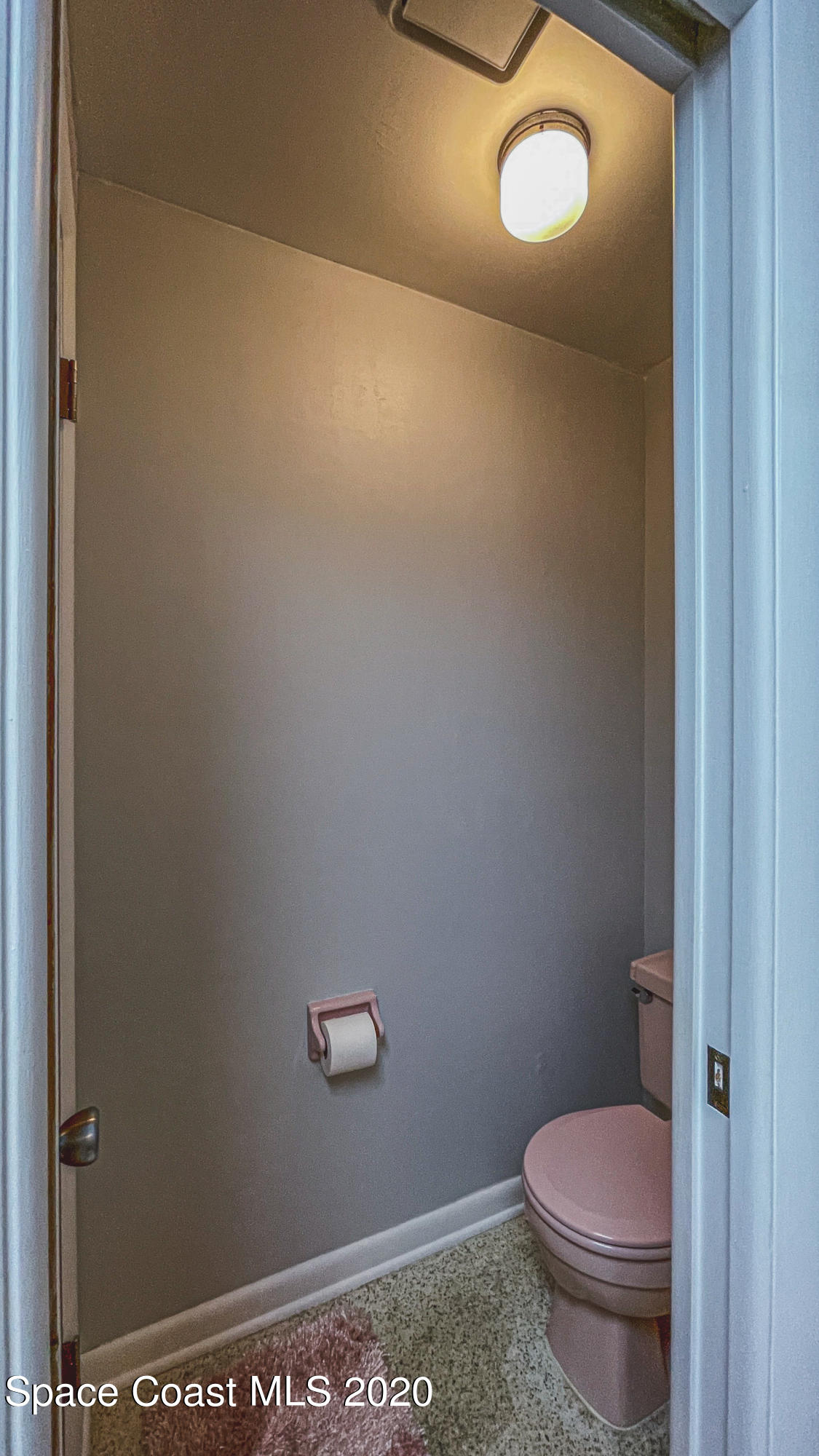 1945 Trimble Road Melbourne, FL 32934 - Photo 73 of 83 a bathroom with a toilet