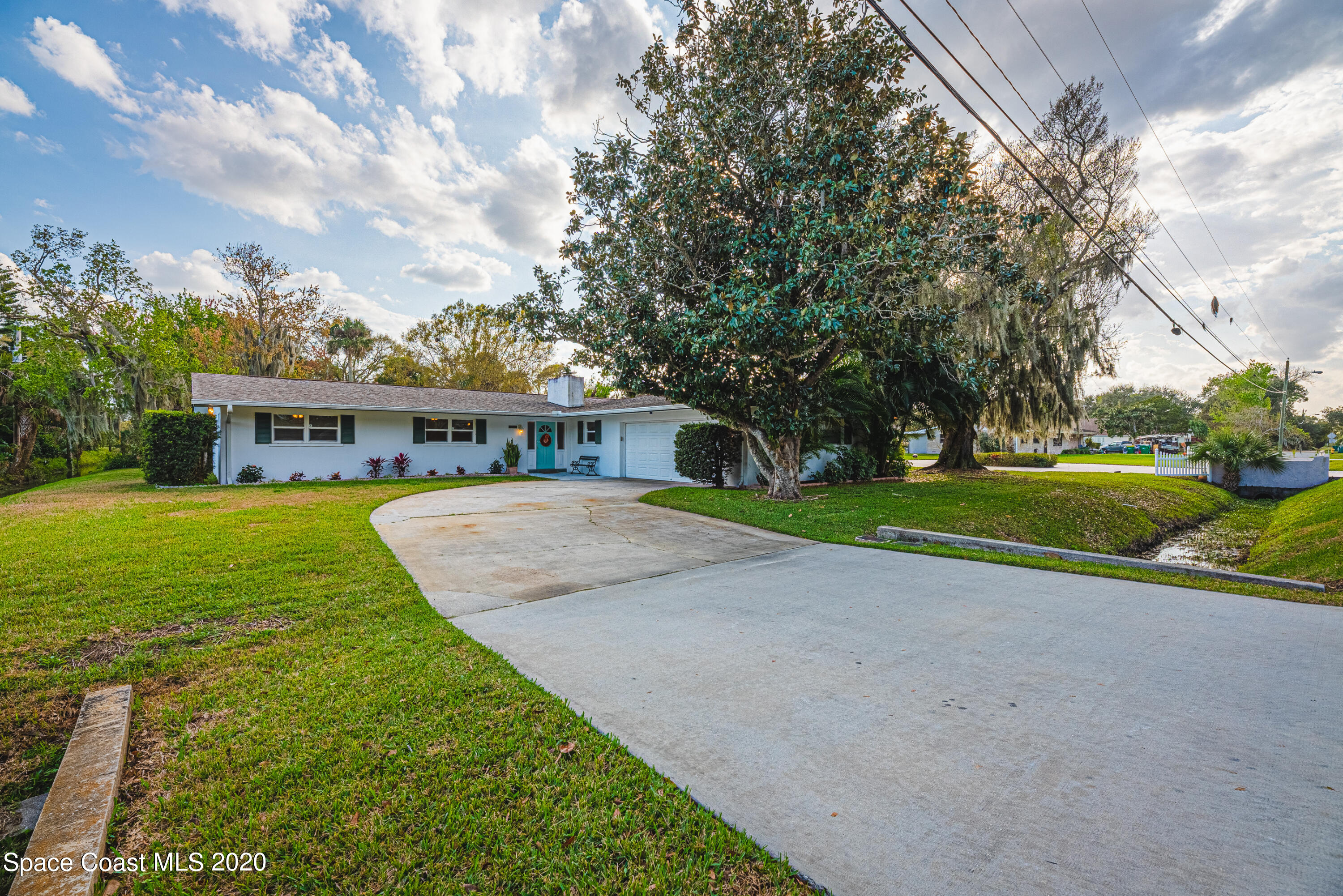 1945 Trimble Road Melbourne, FL 32934 - Photo 81 of 83 a view of house with outdoor space and swimming pool