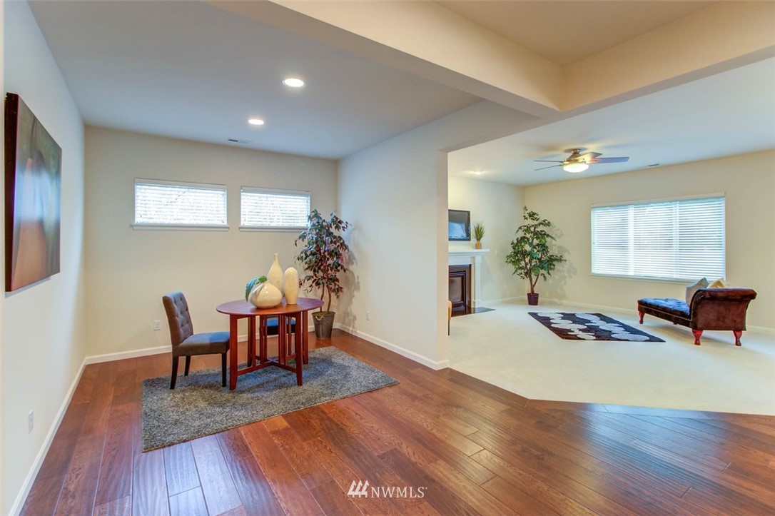 3110 183rd Place Southeast Bothell, WA 98012 - Photo 14 of 40 a living room with furniture and wooden floor