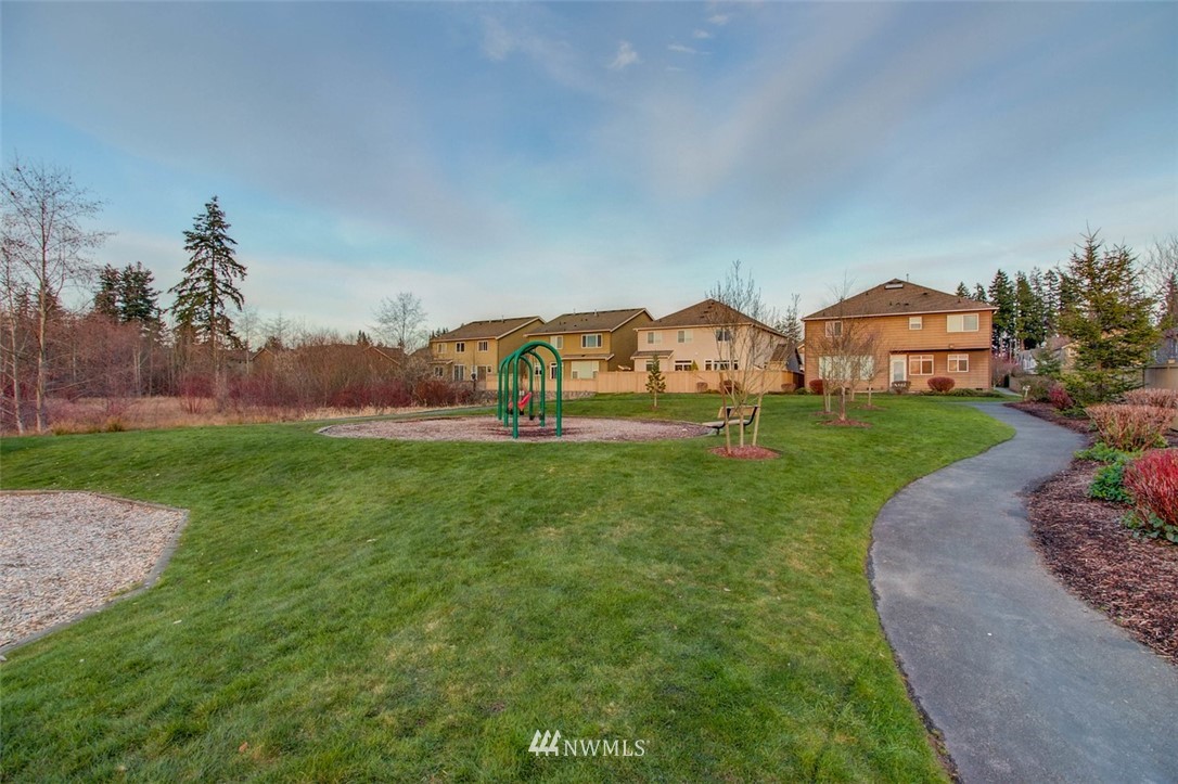 3110 183rd Place Southeast Bothell, WA 98012 - Photo 40 of 40 a view of a big house with a big yard and palm trees